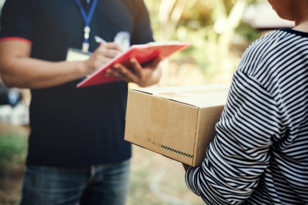 close up woman holding box with service delivery and holding a b